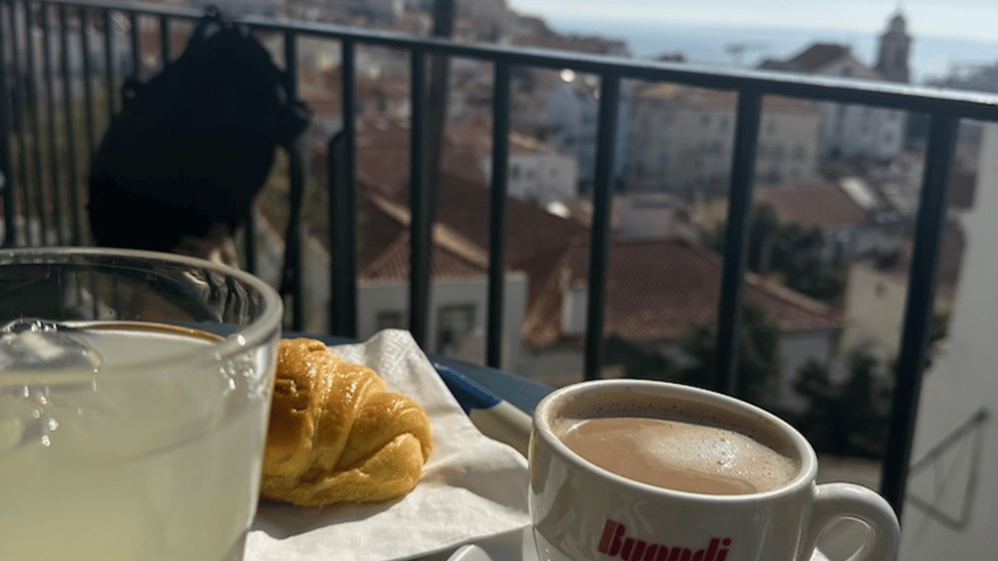 croissant and coffee on a table in lisbon